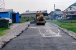 Ямы да ухабы в прошлом: в Тальменке ремонтируют уличные дороги